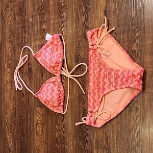 Bikini suit set. Top large(11-13). Bottom small(3-5) orange and pink